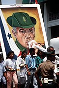 Panamanian civilians carry a portrait of former President Omar Torrijos through the streets outside the gate of Fort Amador, headquarters of the US Southern Command - DPLA - 2af6f38fafcddc3f1d8661f05b8f08c5.jpeg