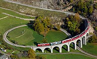 107 votes in Final; Two Rhaetian Railways ABe 4/4 III multiple units with a local train traversing the spiral viaduct near Brusio, Switzerland. +/− Credit:Kabelleger / David Gubler (http://www.bahnbilder.ch) (License: GFDL / CC BY-SA 3.0)