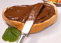 Nutella spread atop bread Nutella (cropped).jpg