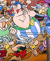 Extrait d'une fresque montrnt des personnages d'Astérix en train de courir.