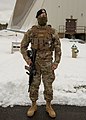 Member of Air Force Security Forces standing watch in front of the PAVE PAWS installation at Cape Cod SFS, 2021.