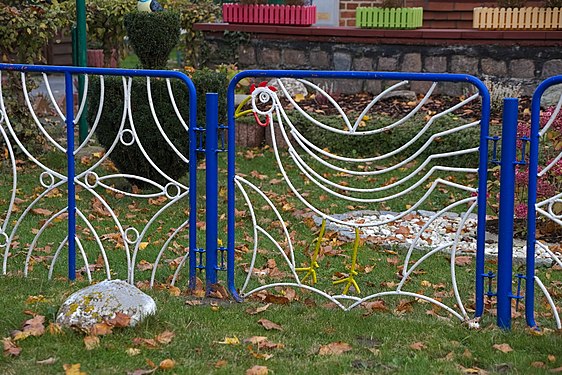 Garden fence with chicken art, northeastern Germany