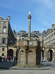 The Mercat Cross on Edinburgh's Royal Mile. An 1885 replacement of the original cross removed in 1756. Mercat Cross, Edinburgh.jpg