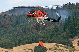 A fire helicopter with helicopter bucket