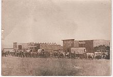 Oxen-drawn freight team entering Custer in 1876 CusterCity1876front.jpg