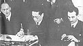 Dr. T. V. Soong, Minister of Foreign Affairs, signing new treaties by which Great Britain and the United States relinquished their special rights in China.