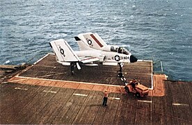 Vought F7U Cutlass on flight deck elevator