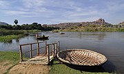 Flowing through its rocky terrain near Hampi is the Tungabhadra river, the major right bank tributary of the Krishna river, a peninsular river, which empties into the Bay of Bengal. The coracles, made of wicker, are traditionally covered with hide, their circular shape preventing them from overturning in rivers with rocky outcrops.