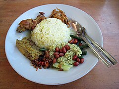 Nasi campur Bali served with ayam betutu and vegetables