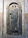 Statue de Félix à la cathédrale de Norwich réalisée entre 1096 et 1119, sous l'épiscopat de Herbert de Losinga.
