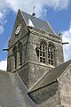 Church bell tower with dummy parachutist.