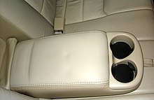 The armrest in the back seat of a Lincoln Town Car, featuring two cup holders. Armrest.jpg