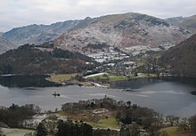 Glenridding across Ullswater, with one of the steamers leaving the pier GlenriddingFromSlopesOfPlaceFell.jpg