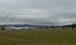 L-R: Gymnasium, Mess, 100m gate entrance, main building, car park, 100m fence. To the right is part of the Kowen forest in the Australian Capital Territory HQJOC.JPG