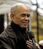 Thiền sư Thích Nhất Hạnh: người đưa ra khái niệm "Phật giáo dấn thân," được đề cử Giải Nobel Hòa bình năm 1967[73]