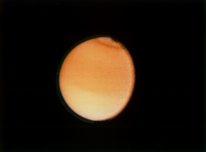 Another image of Titan taken by Voyager 2 on August 23, 1981, a few months after Voyager 1 arrived at Saturn first. The spacecraft was around 2,300,000 kilometres or 1,400,000 miles away from the moon.[214]