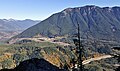 Mailbox Peak, seen from Salal Point. Washington State Fire Training Academy at the foot of the mountain. Interstate 90 in lower right. Moolock Mountain in the distance to left. Dirty Harry's Peak on the right side of the ridge.