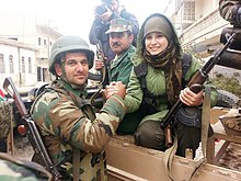 People's Defense Units' (YPG) woman volunteer with Peshmerga soldier Peshmerga & YPG.jpg