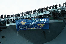 Twenty-five year "Silver Anniversary" banner hanging from the starboard bow missile sponson of John F. Kennedy, 7 April 1993 DN-ST-93-03777.jpg