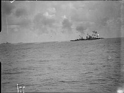 HMS Naiad fires on enemy aircraft with her fore turrets during operations in the Mediterranean, March 1942 HMS Naiad firing.jpg