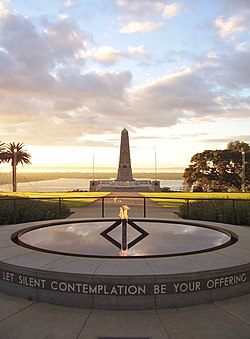 A picture of the Eternal flame with the State War Memorial behind it.