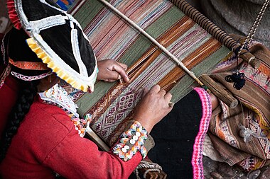 Native Peruvian woman weaving textiles. 20 Oct. 2009. Photo by Jae.