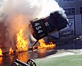 A police car being flipped after an explosion.