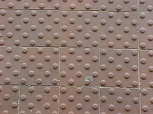 A grid of tiles, each with a grid of bumps on them