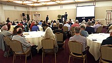 NOCIRC 15th International Symposium on Genital Integrity attendees watching a presentation, San Francisco, 2018