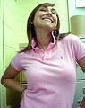 Image 28Woman wearing a polo shirt with a popped collar. (from 1990s in fashion)