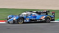 A blue, white and black LMP2 car being raced at Silverstone Circuit in 2018
