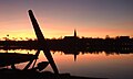 During twilight over the town bay and the silhouette.