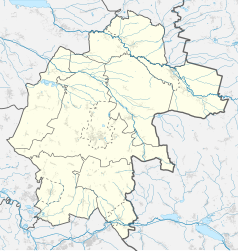 Mapa konturowa powiatu strzeleckiego, blisko centrum na lewo znajduje się punkt z opisem „Suche Łany”