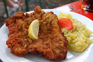 <span class="mw-page-title-main">Schnitzel</span> Breaded, fried flat piece of meat