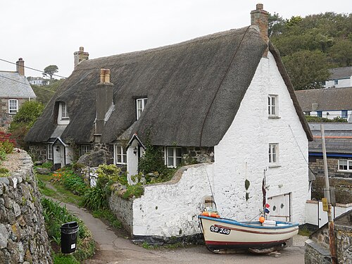 House with thatched roof in Cadgwith, Cornwall, England