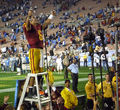 Mark Sanchez salutes the fans and conducts the USC Band