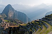 The mountain Huayna Picchu overlooks the Inca estate (land) of Machu Picchu