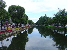 View south along the eastern moat of city center, Chiang Mai. The road on the right is Moon Muang, on the left, Chaiyapoom