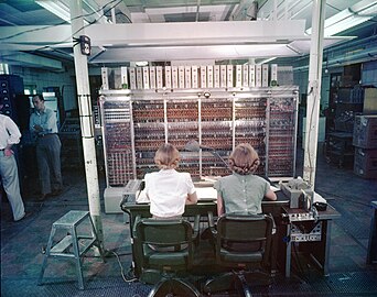 Operators are pictured here in 1952 in front of the MANIAC. The horseshoe on the pillar on the right was hung for luck.