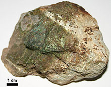 Hand sample of skarn containing serpentinite from the edge of the Alta Stock, Little Cottonwood Canyon, Utah Skarn Alta Stock.jpg