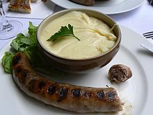 Aligot, a regional French dish made from melted cheese blended into mashed potatoes, often with some garlic Bol d'aligot.jpg