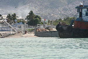 Port-au-Prince harbour after the deadly earthquake. The port was too damaged to receive cargo from aid ships sent to the country.