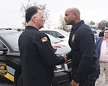 Salling shakes hands with Governor Wes Moore during a press conference on the Francis Scott Key Bridge collapse, 2024 Press Conference (53622715006).jpg