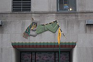 Lintel depicting a woman above the entrance at 10 West 51st Street