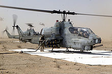 Cobra attack helicopters being refueled at a MWSS-373 FARP during Operation Iraqi Freedom. Refueling Cobra.jpg