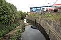 The River Brent at Vicar's Bridge, Alperton. Here the river serves as the boundary for two London boroughs: Ealing (left bank) and Brent (right bank).