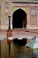 The courtyard ablution pool features a small fountain.