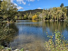 Recreational lake in Prades near the Têt river. The hills beyond, which are to the north of the town, are mostly in lower Palaeozoic schist.