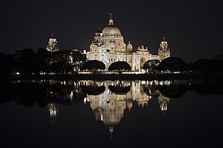 Victoria Memorial illuminated at night.