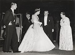 SLNSW - Queen Elizabeth and Prince Philip, Duke of Edinburgh, greeted by the Premier of New South Wales Cahill and Mrs Cahill on arrival at David Jones Elizabeth Street Store, Sydney, for the State Dinner (4 February 1954).jpg